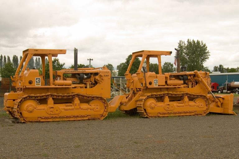 Caterpillar DD9H Track-Type tractor with a blade for pushing scrapers