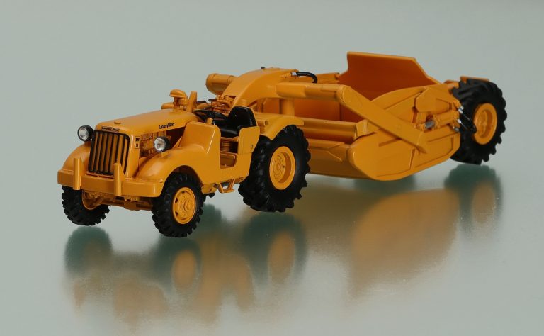 Caterpillar DW10 6V series wheeled tractor with LaPlant-Choate CW-10 Carrimor towed hydraulic scraper
