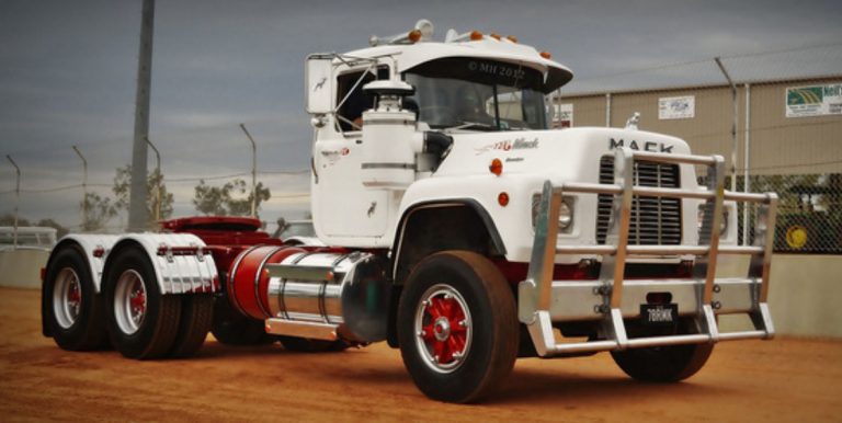 Mack R600ST truck tractor with low-frame front treller Talbert T3DW-80